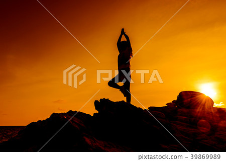 Silhouette woman exercise on the beach sunset. Silhouette woman exercise on the beach sunset. 39869989