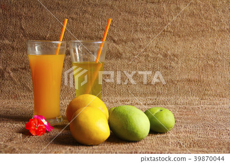 Alphonso mango & raw mango fruit with their juices Alphonso mango & raw mango fruit with their juices 39870044