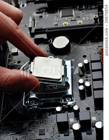 Plug in CPU microprocessor to motherboard socket. Plug in CPU microprocessor to motherboard socket. 39870854