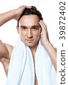 Portrait of handsome man toweling isolated. 39872402