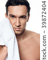 Portrait of handsome man toweling isolated.  39872404