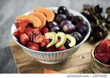 fruit salad in a ceramic bowl 39873085