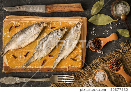 Dried fish on a dark concrete background Dried fish on a dark concrete background 39877380