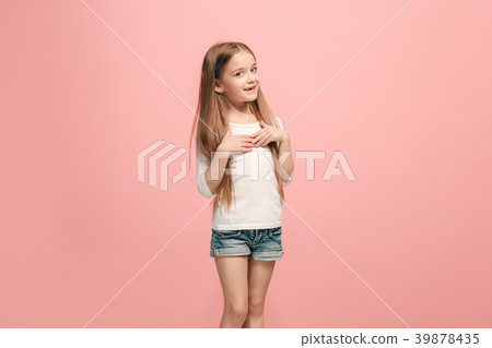 The happy teen girl standing and smiling against 39878435