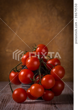 Juicy fresh red tomatoes on wooden board Juicy fresh red tomatoes on wooden board 39879550