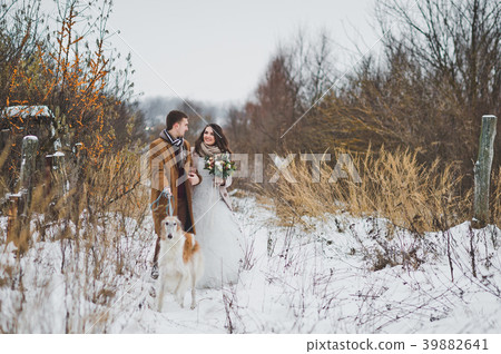 The bride and groom on a winter walk The bride and groom on a winter walk 39882641