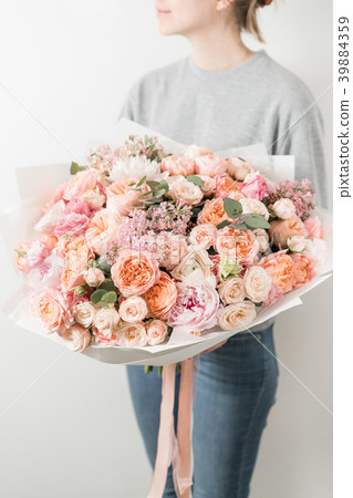 bouquet of beautiful flowers in women's hands bouquet of beautiful flowers in women's hands 39884359