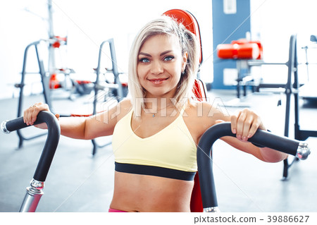 the girl does exercises on simulators the girl does exercises on simulators 39886627