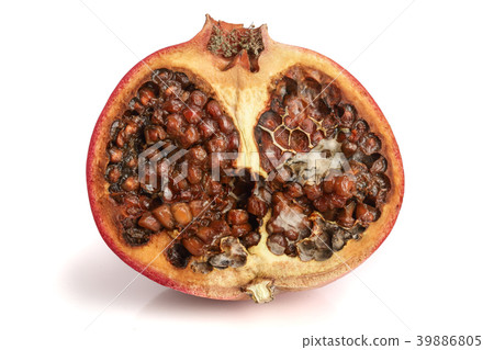 spoiled pomegranate isolated on white background spoiled pomegranate isolated on white background 39886805