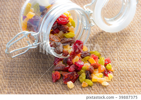 Dried fruits packed in small bottles Dried fruits packed in small bottles 39887375