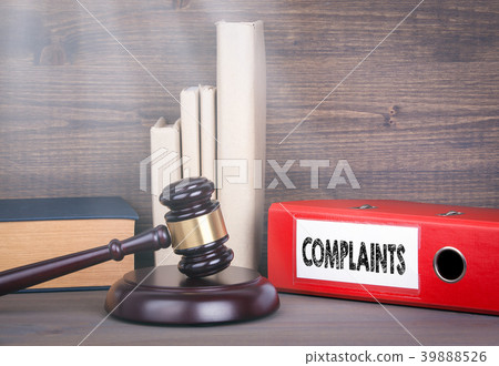 Complaints. Wooden gavel and books in background. Law and justice concept Complaints. Wooden gavel and books in background. Law and justice concept 39888526