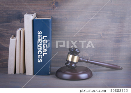 Legal Services. Wooden gavel and books in background. Law and justice concept Legal Services. Wooden gavel and books in background. Law and justice concept 39888533