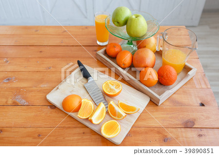 Still life: oranges and glass of juice on a wooden 39890851