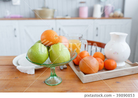 Still life: oranges and glass of juice on a wooden 39890853