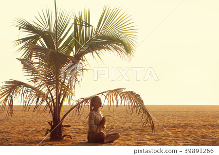A woman meditating A woman meditating 39891266