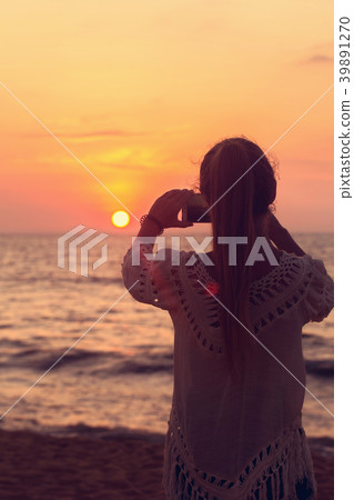 A girl takes a picture A girl takes a picture 39891270