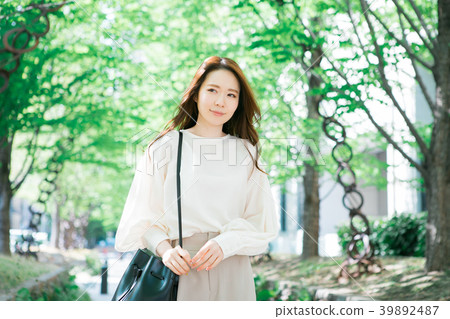 Woman walking on green arch 39892487