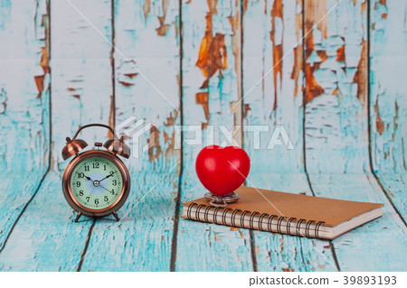red heart ball on book note ,concept fixy heart . red heart ball on book note ,concept fixy heart . 39893193