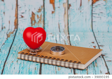 red heart ball on book note ,concept fixy heart . red heart ball on book note ,concept fixy heart . 39893195