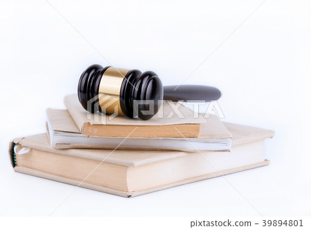 Wooden gavel and books in background. Law and justice concept Wooden gavel and books in background. Law and justice concept 39894801