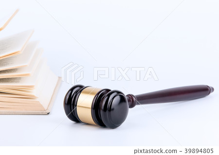 Wooden gavel and books in background. Law and justice concept Wooden gavel and books in background. Law and justice concept 39894805