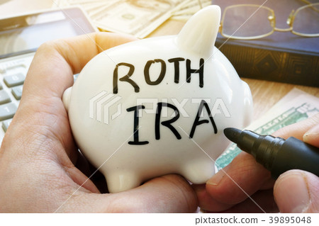 Piggy bank with Roth IRA. Pension plan. 39895048