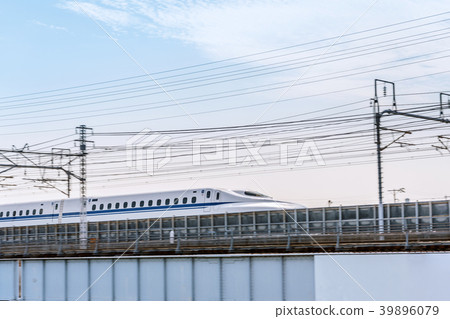 Shinkansen speeding on iron bridge 39896079