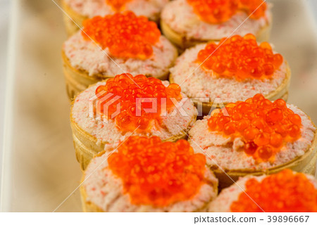 Tartlets with cheese and red caviar. Selective 39896667