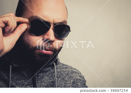 Handsome young man in sunglasses. 39897254