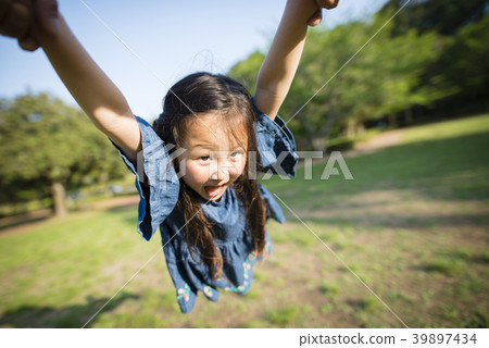 Daughter playing with father Daughter playing with father 39897434