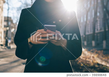 Cropped photo of business woman in black coat Cropped photo of business woman in black coat 39898648