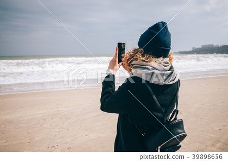 Young hipster woman traveler taking picture Young hipster woman traveler taking picture 39898656