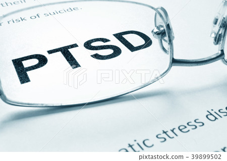 PTSD sign on a paper and glasses. 39899502