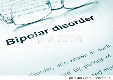 Bipolar disorder sign on a paper and glasses. Bipolar disorder sign on a paper and glasses. 39899503
