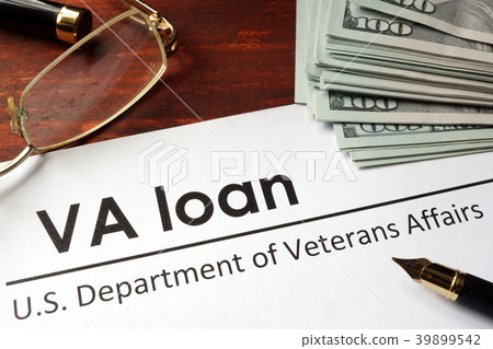 Paper with words va loan on a wooden background. Paper with words va loan on a wooden background. 39899542