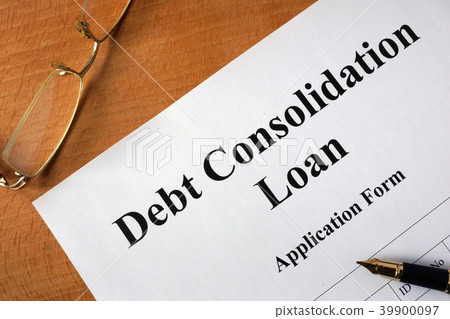 Debt consolidation loan form on a wooden table. Debt consolidation loan form on a wooden table. 39900097