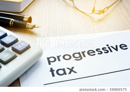 Papers about progressive tax on an office desk. 39900575