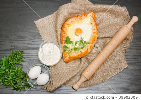 Georgian cuisine. Khachapuri on sackcloth, flour 39902309