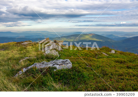 rocky formations on the grassy hills rocky formations on the grassy hills 39903209