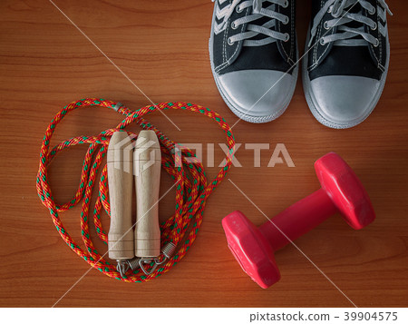 Sports shoe with a Jump rope and dumbbell. 39904575