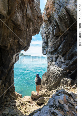 Travel people women tourist in a cave near the sea Travel people women tourist in a cave near the sea 39906878