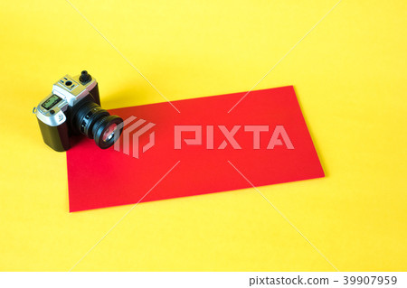 Mini camera toy and red envelop on yellow Mini camera toy and red envelop on yellow 39907959