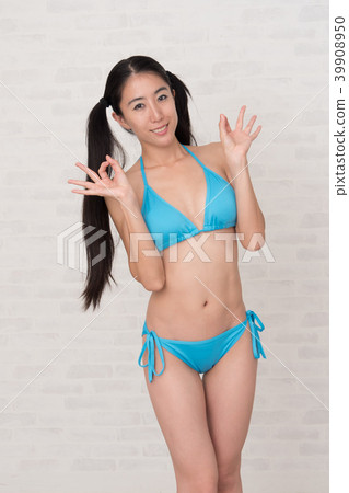 A woman wearing a bikini has various poses and expressions in front of a white background. 39908950