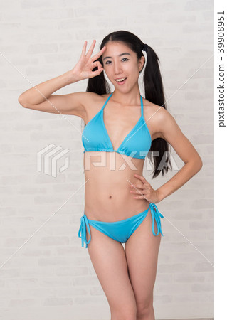 A woman wearing a bikini has various poses and expressions in front of a white background. 39908951