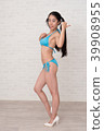 A woman wearing a bikini has various poses and expressions in front of a white background. 39908955
