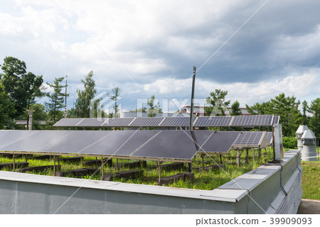 Solar battery background of the cloudy sky. 39909093