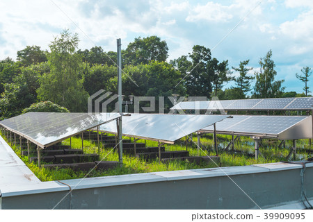Solar battery background of the cloudy sky. 39909095
