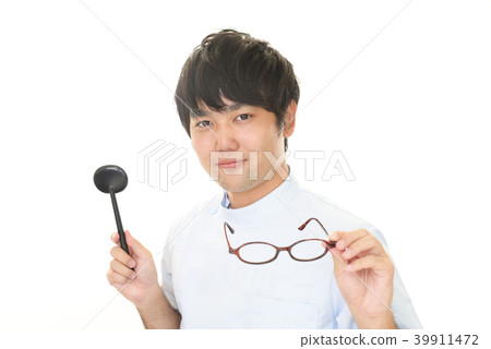 Smiling doctor with a blinder Smiling doctor with a blinder 39911472