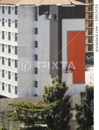 group of worker painting on new building 39915459