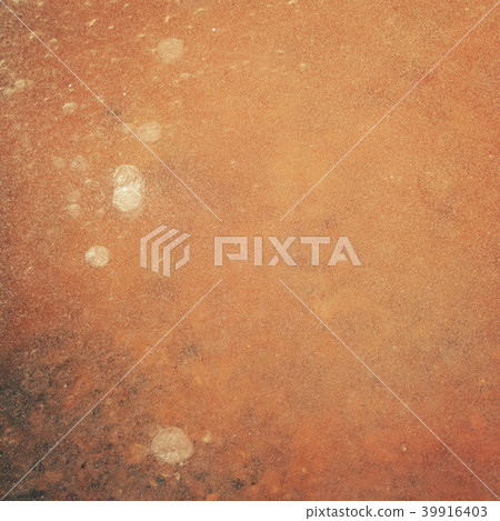 Layer of ice over an orange clay soil. Texture. Layer of ice over an orange clay soil. Texture. 39916403